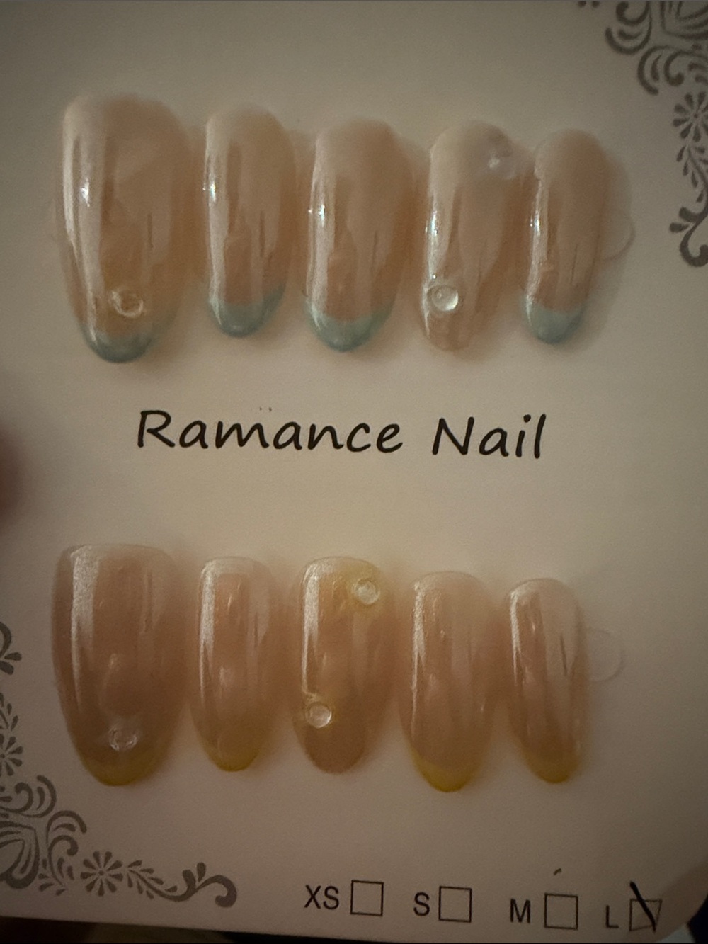 Neutral Nude Press-On Nails with Subtle blue and yellow Colored French Tips